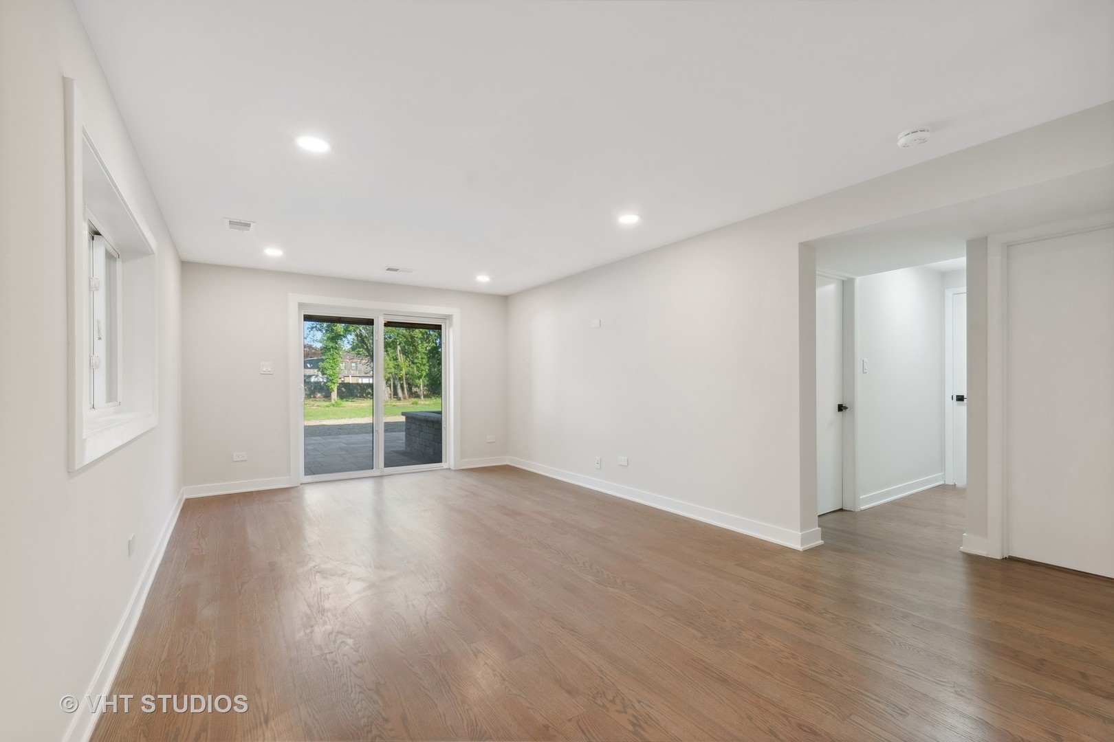 695 Ridge Road Highland Park, IL 60035 - Photo 12 of 23 a view of a big room with wooden floor and windows