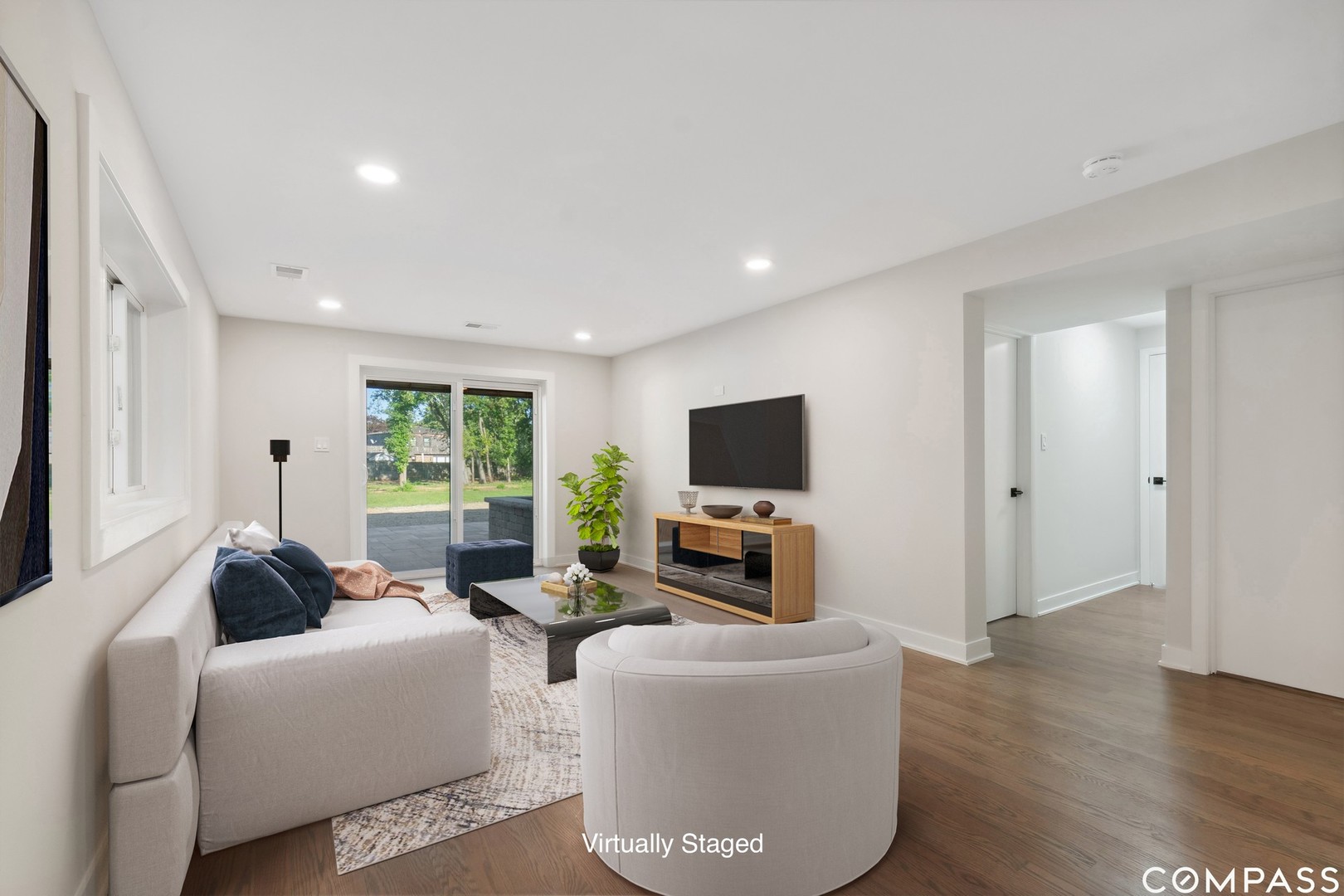 695 Ridge Road Highland Park, IL 60035 - Photo 13 of 23 a living room with furniture a flat screen tv and a large window