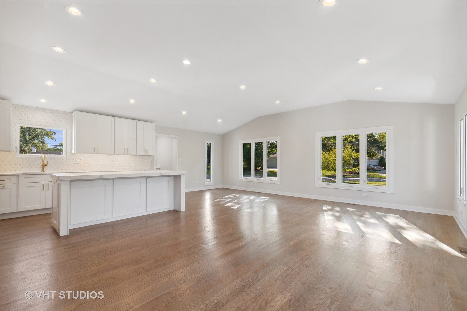 695 Ridge Road Highland Park, IL 60035 - Photo 5 of 23 a large white kitchen with kitchen island granite countertop a large window
