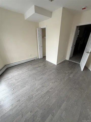 a view of an empty room and entryway