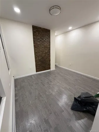 an empty room with wooden floor