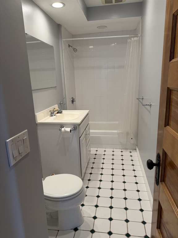 29 Boardman Street, Unit 2 Worcester, MA 01606 - Photo 13 of 16 a bathroom with a sink a toilet and shower