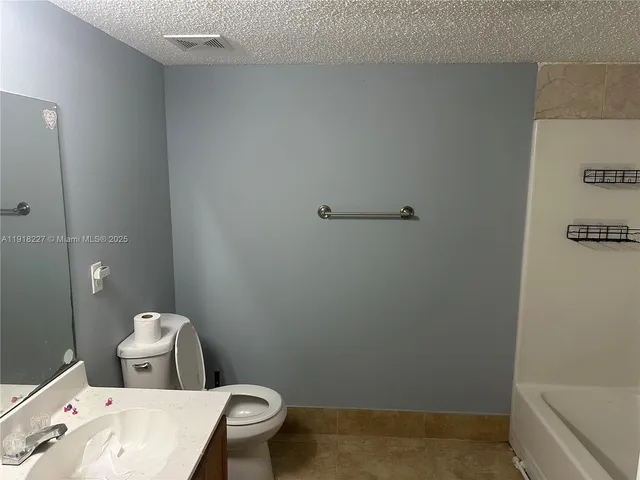 a bathroom with a toilet and a sink