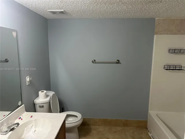 a bathroom with a toilet and a sink