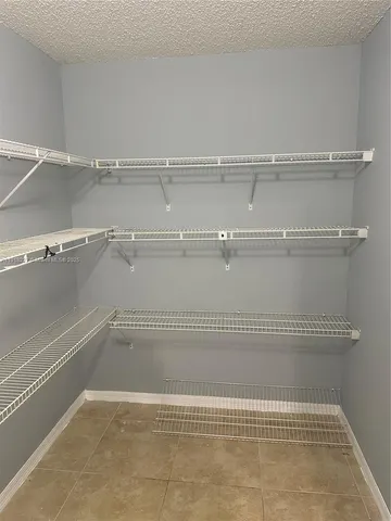 a view of a room with racks on the wall