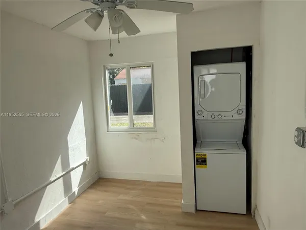 a view of hallway with chandelier and entryway