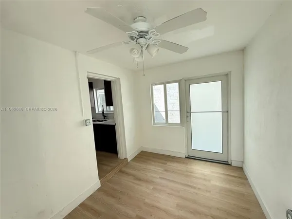 a view of an empty room with a window