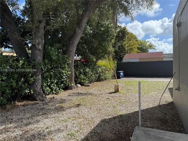 a backyard of a house with lots of green space