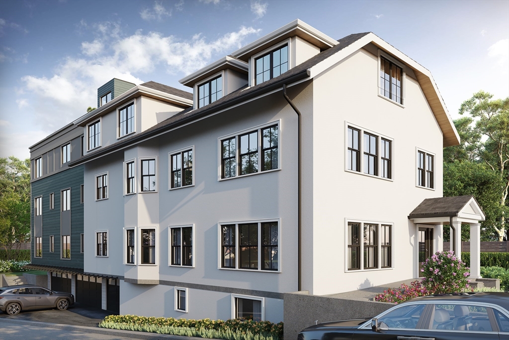 63 Green Street, Unit 2 Brookline, MA 02446 - Photo 1 of 12 a view of a white building among the street with palm trees
