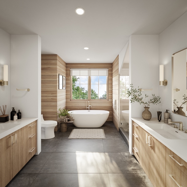 63 Green Street, Unit 2 Brookline, MA 02446 - Photo 12 of 12 a spacious bathroom with a double vanity sink a mirror and a bathtub