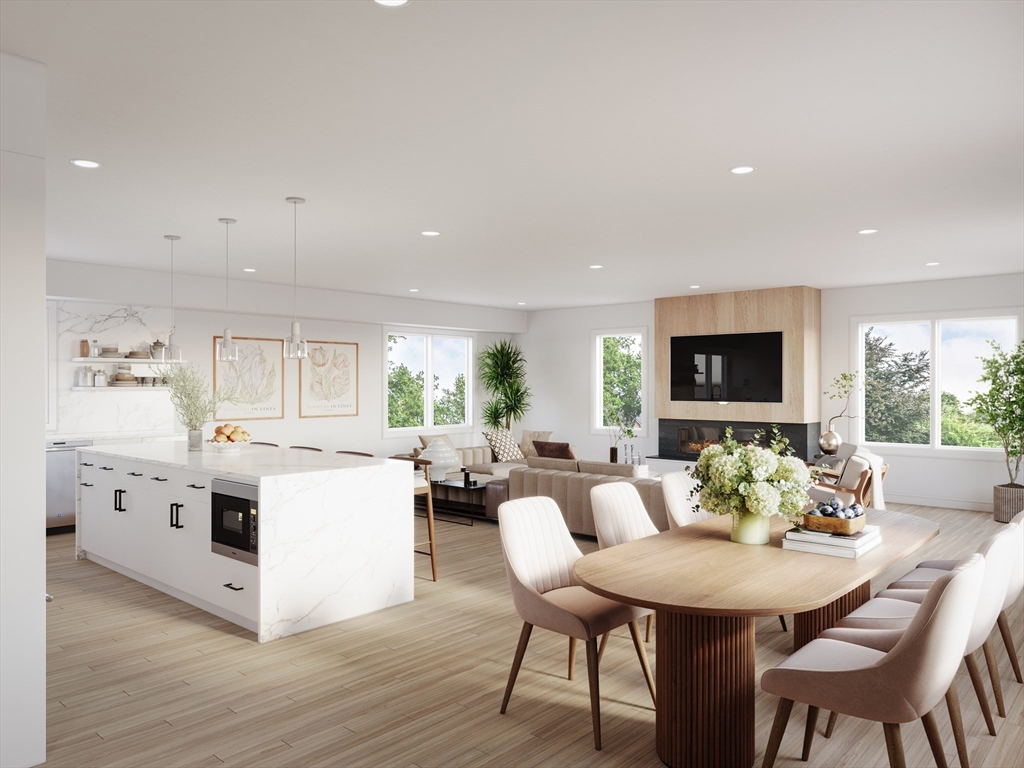 63 Green Street, Unit 2 Brookline, MA 02446 - Photo 7 of 12 a view of a dining room with furniture and wooden floor