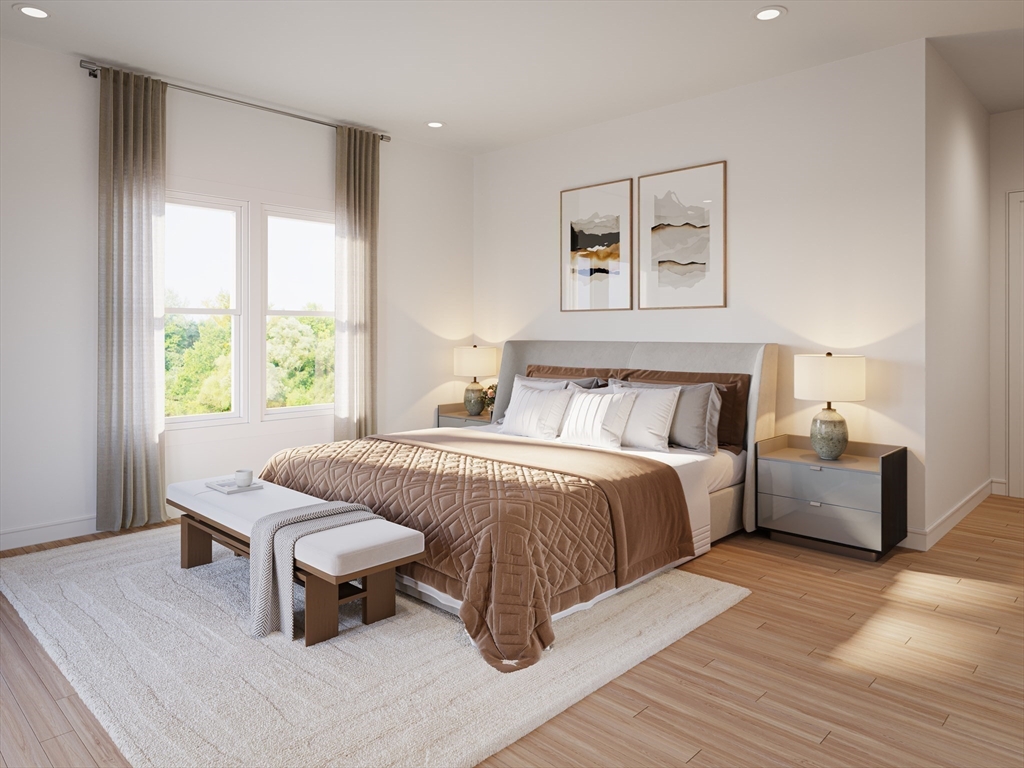 63 Green Street, Unit 2 Brookline, MA 02446 - Photo 10 of 12 a bedroom with a large bed and a window