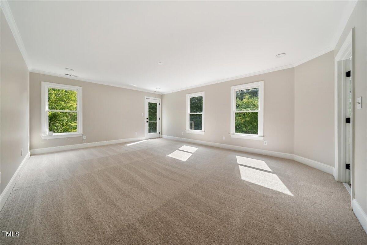 6300 Swallow Cove Lane Raleigh, NC 27614 - Photo 27 of 67 an empty room with windows and entrance
