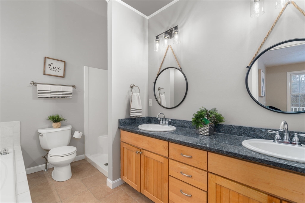 66 A New Boston Road Sturbridge, MA 01566 - Photo 13 of 29 a bathroom with a granite countertop toilet sink and mirror
