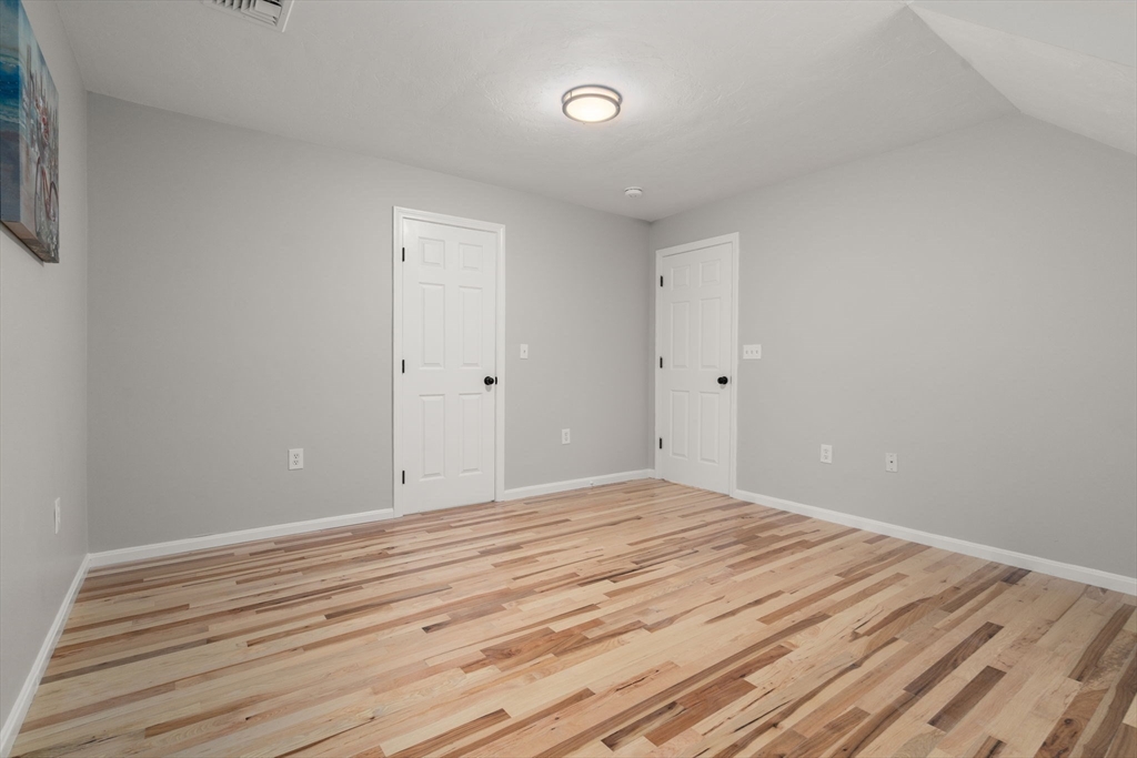 66 A New Boston Road Sturbridge, MA 01566 - Photo 15 of 29 a view of a room with wooden floor and white walls