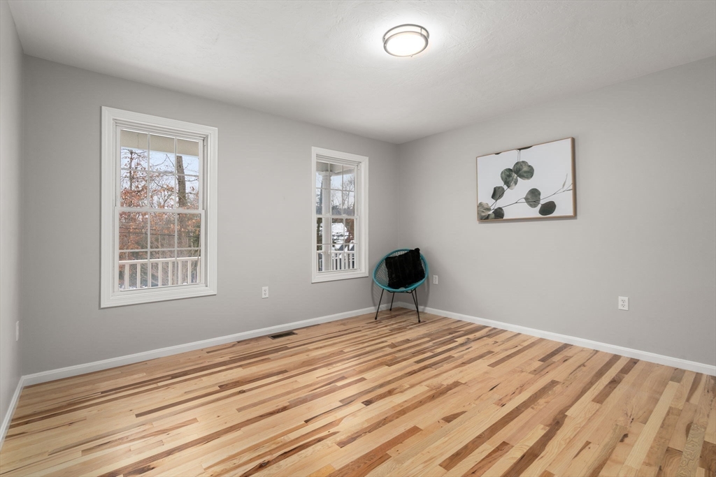 66 A New Boston Road Sturbridge, MA 01566 - Photo 16 of 29 a view of wooden floor and a window in a room
