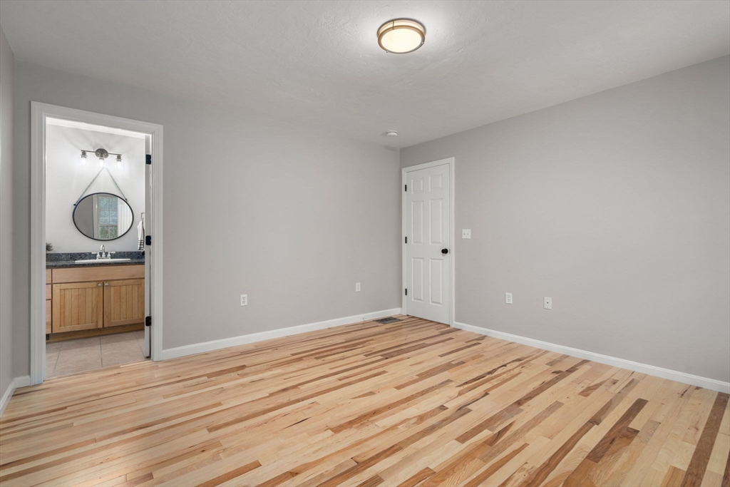 66 A New Boston Road Sturbridge, MA 01566 - Photo 18 of 29 a view of empty room with wooden floor