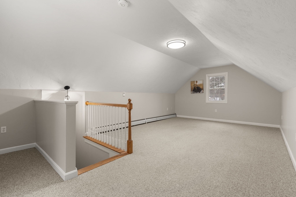 66 A New Boston Road Sturbridge, MA 01566 - Photo 20 of 29 an empty room with a ceiling fan and windows