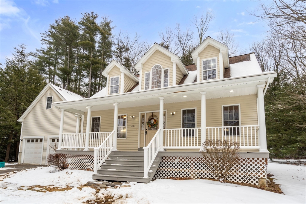 66 A New Boston Road Sturbridge, MA 01566 - Photo 2 of 29 a front view of a house with a yard