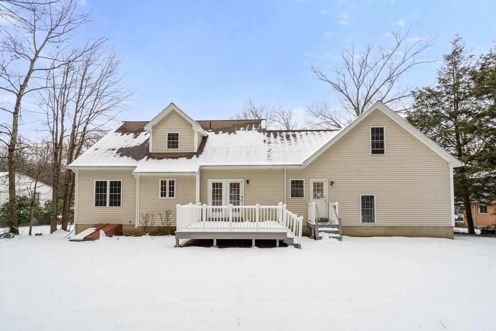 66 A New Boston Road Sturbridge, MA 01566 - Photo 25 of 29 a front view of a house with a yard and garage