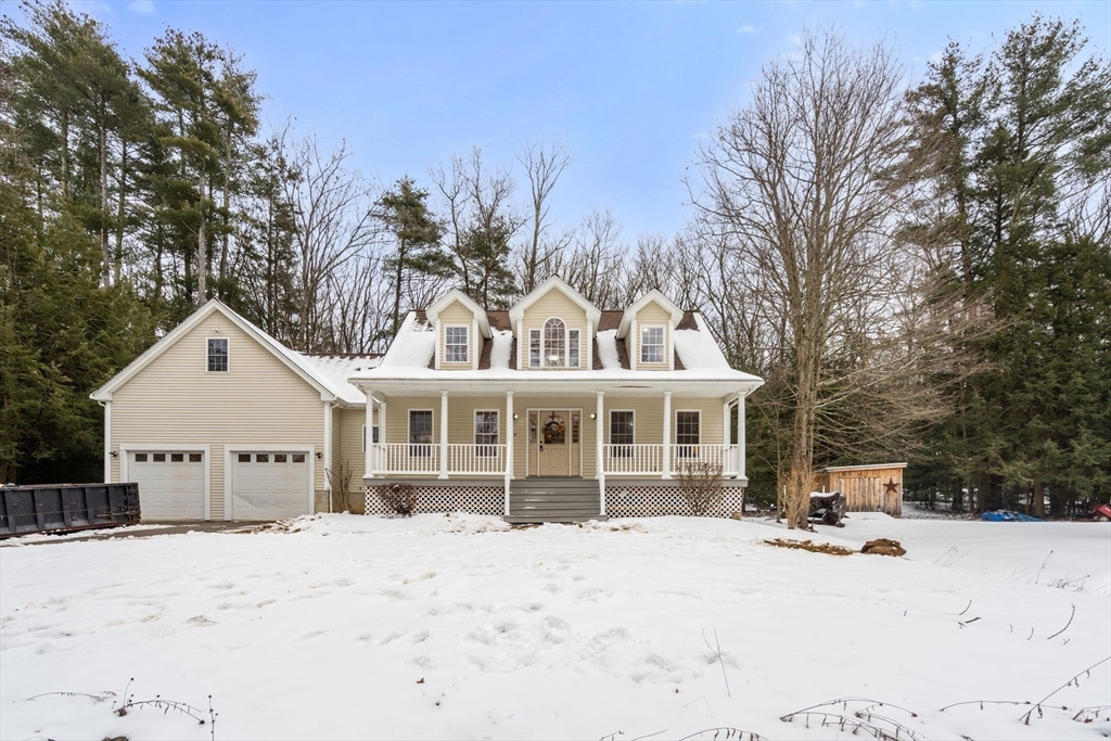 66 A New Boston Road Sturbridge, MA 01566 - Photo 28 of 29 a view of a white house with a yard covered in snow