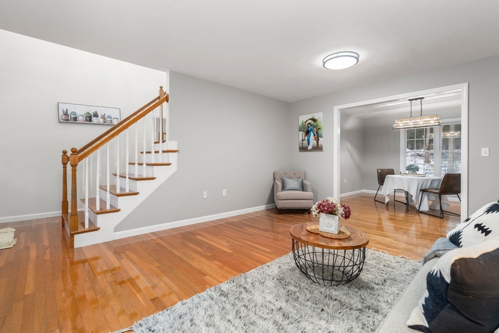 66 A New Boston Road Sturbridge, MA 01566 - Photo 3 of 29 a living room with furniture and wooden floor