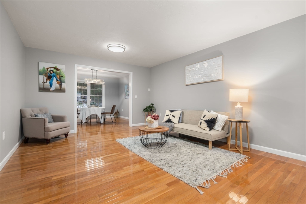 66 A New Boston Road Sturbridge, MA 01566 - Photo 4 of 29 a living room with furniture and wooden floor