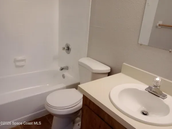 a bathroom with a toilet sink and bathtub