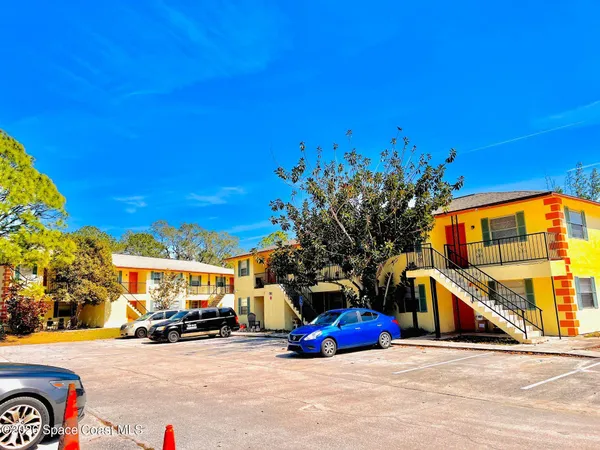a view of a street with cars