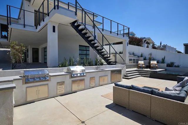 a kitchen with stainless steel appliances granite countertop a stove and cabinets