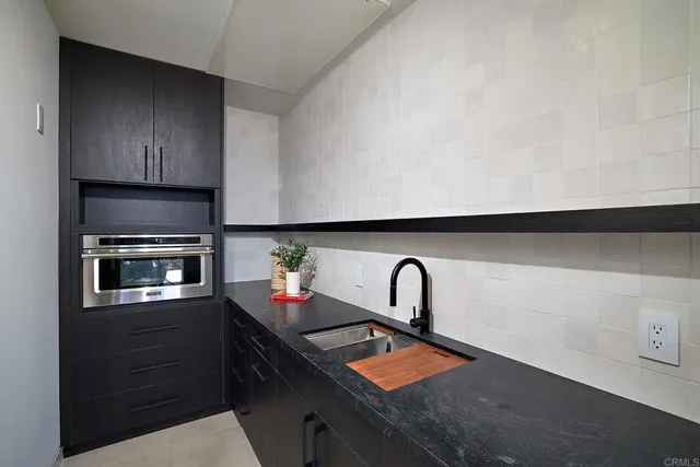 a living room with a table and a potted plant