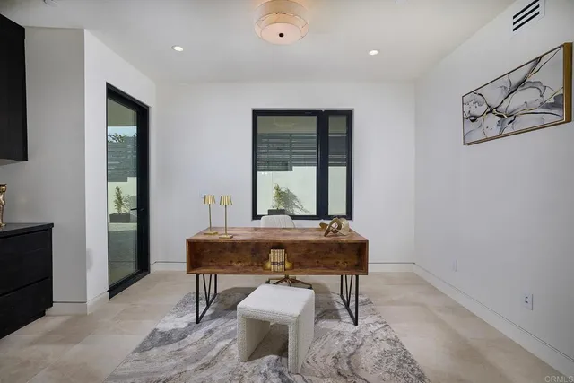 an aerial view of a city with ocean view