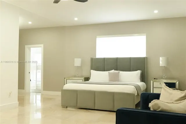 a bedroom with a bed and a couch