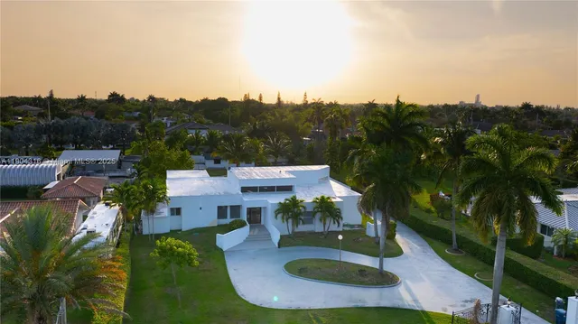 a view of a water fountain in front of the house