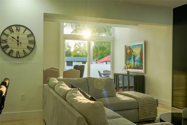 a living room with a couch and a window