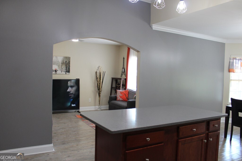 33 Lee Road Phenix City, AL 36870 - Photo 11 of 47 a room with cabinets and wooden floor