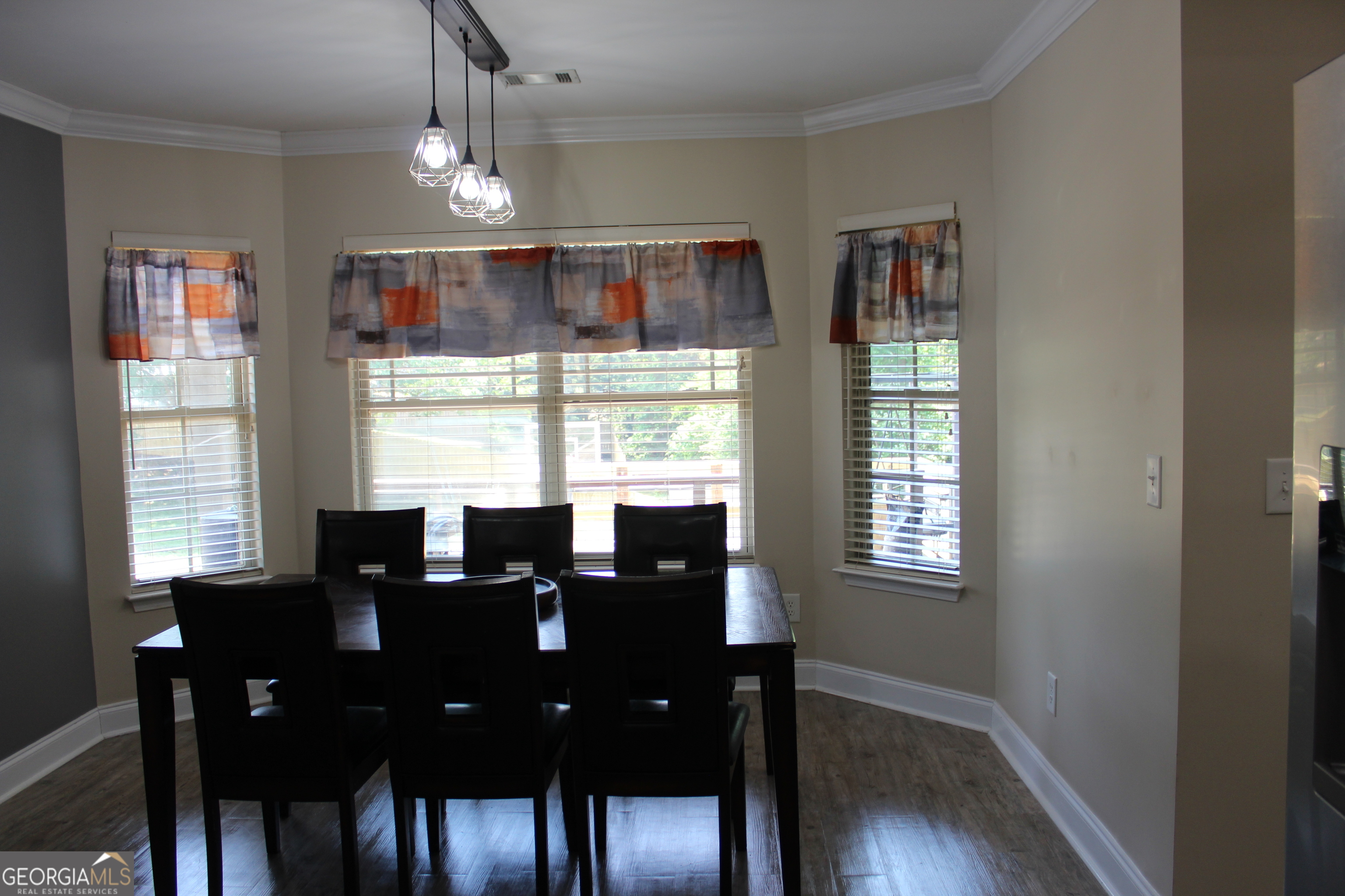 33 Lee Road Phenix City, AL 36870 - Photo 15 of 47 a view of a dining room with furniture window and wooden floor