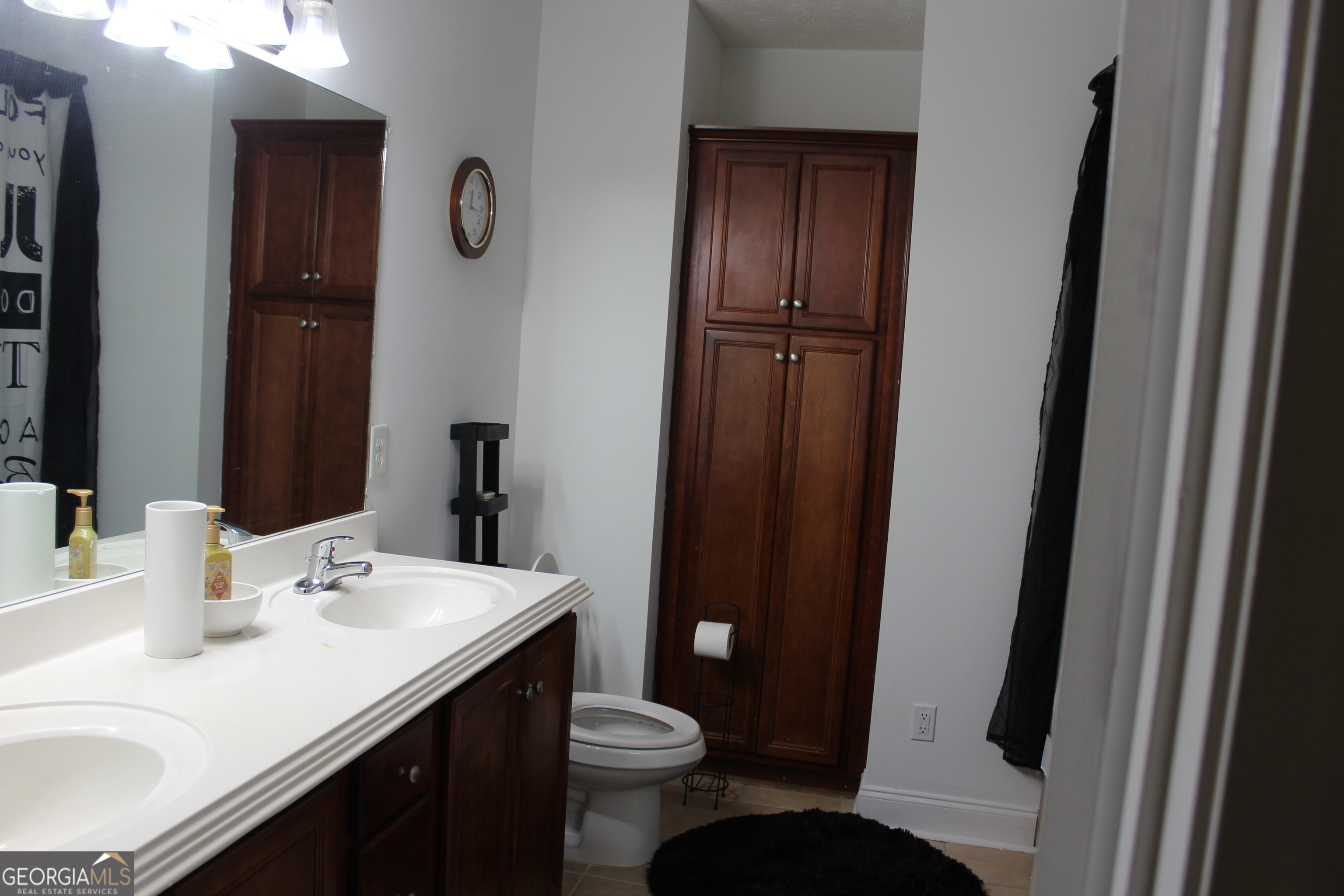 33 Lee Road Phenix City, AL 36870 - Photo 23 of 47 a bathroom with a sink and a mirror