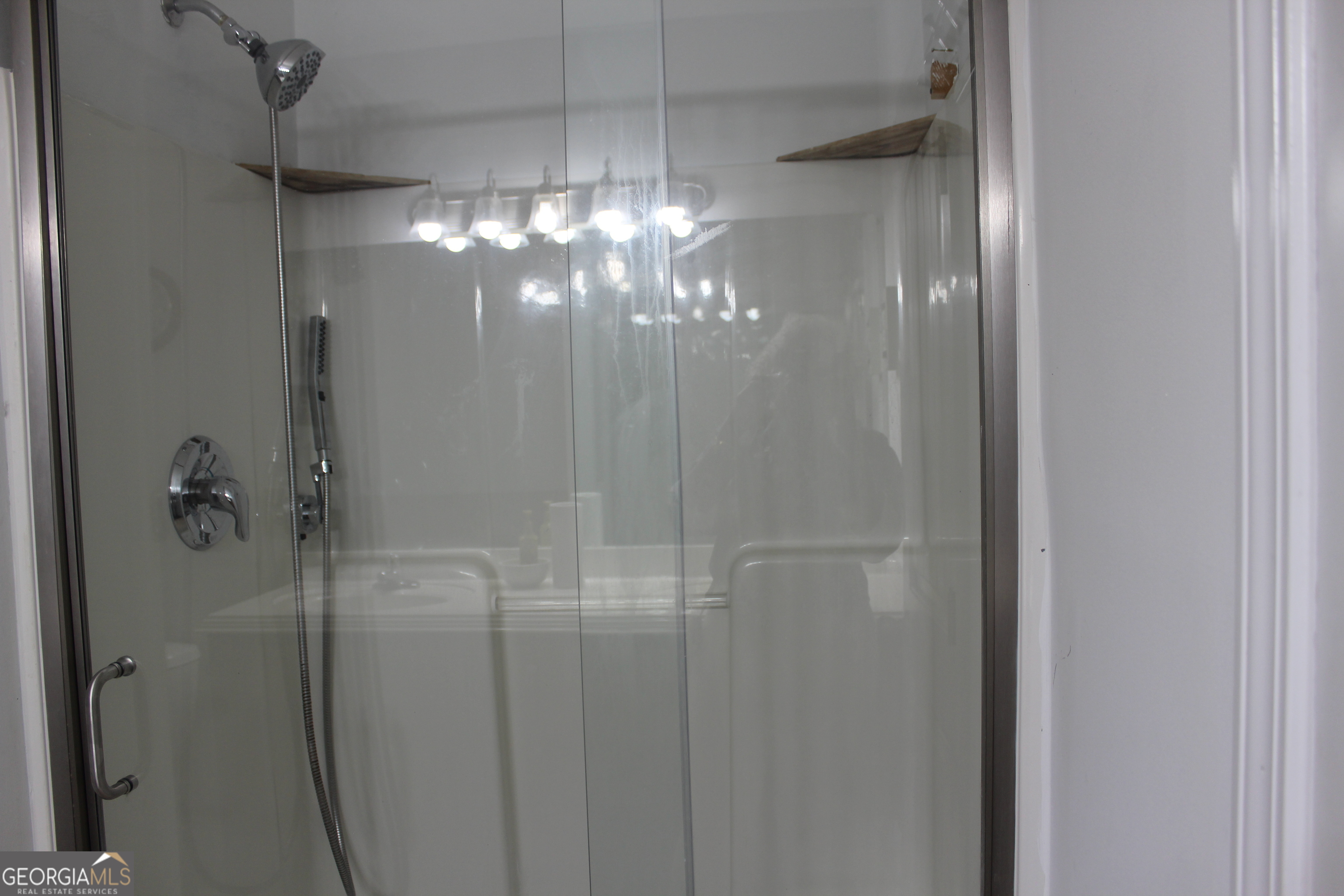 33 Lee Road Phenix City, AL 36870 - Photo 25 of 47 a bathroom with a light fixture and a shower