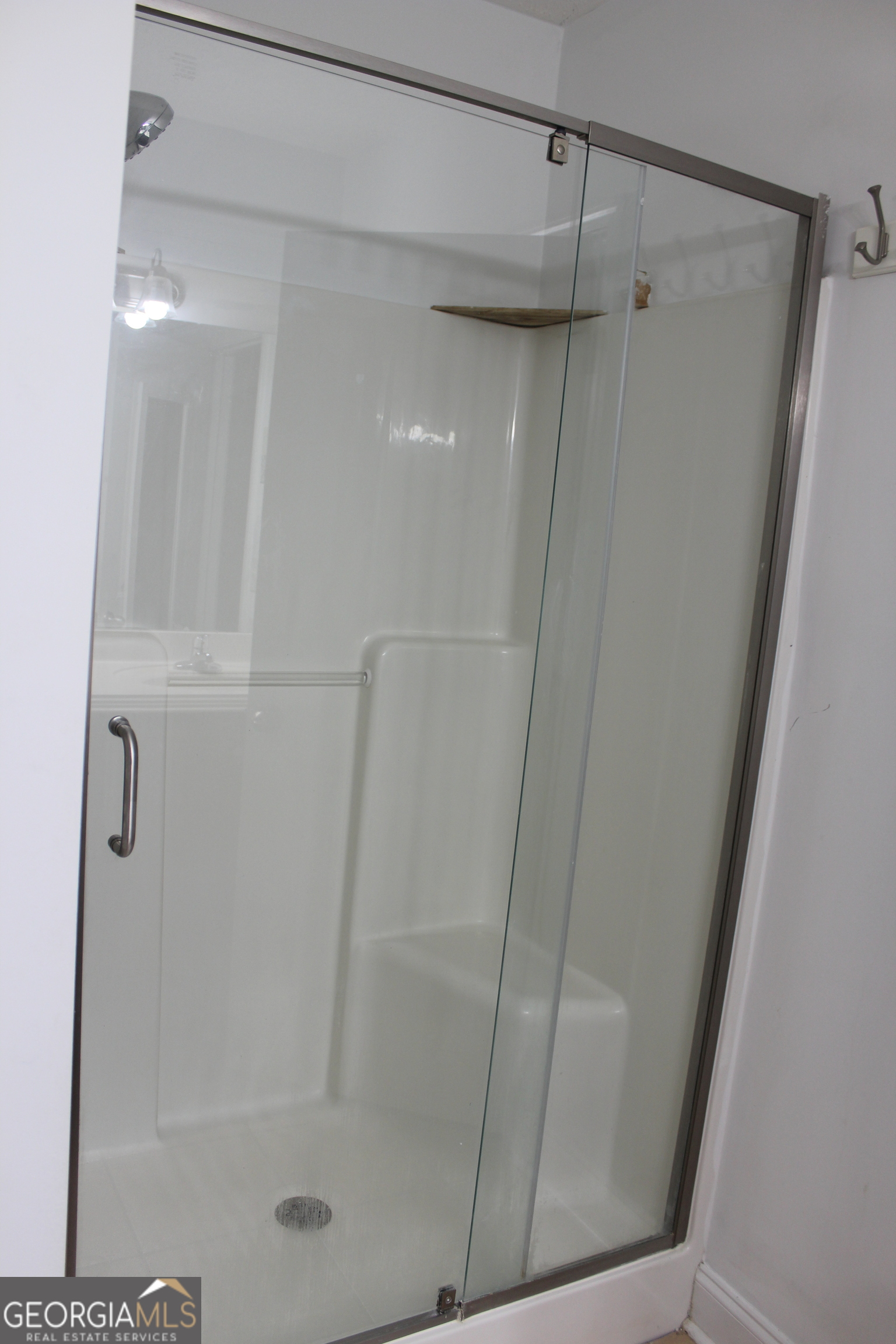 33 Lee Road Phenix City, AL 36870 - Photo 26 of 47 a bathroom with a glass door shower