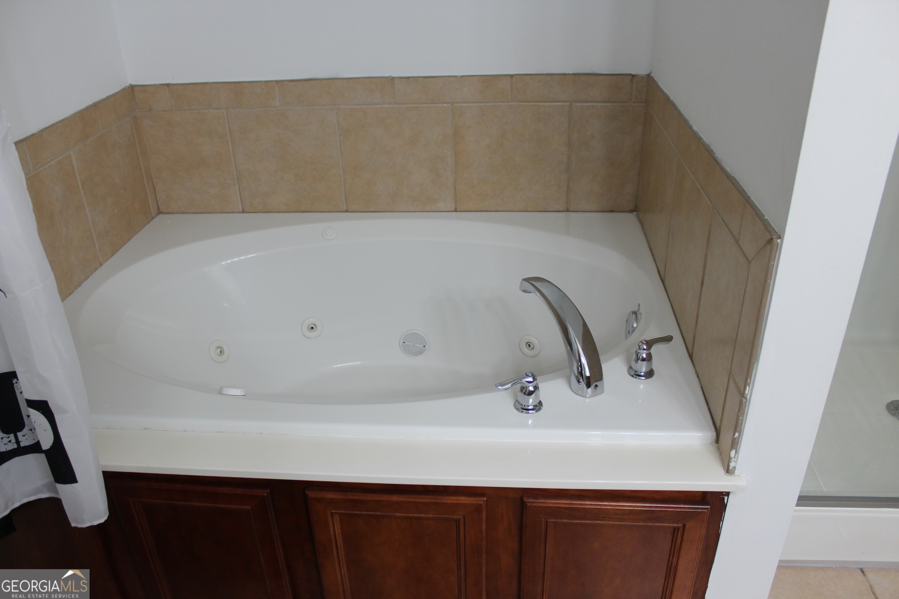 33 Lee Road Phenix City, AL 36870 - Photo 27 of 47 a bathroom with a sink and a bathtub