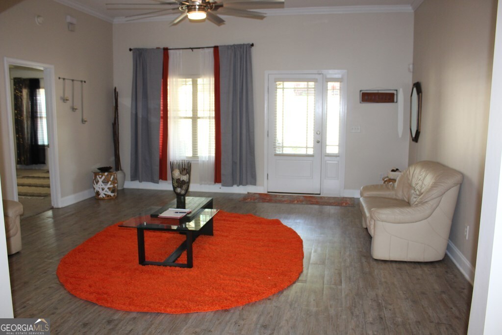 33 Lee Road Phenix City, AL 36870 - Photo 3 of 47 a living room with furniture and a chandelier