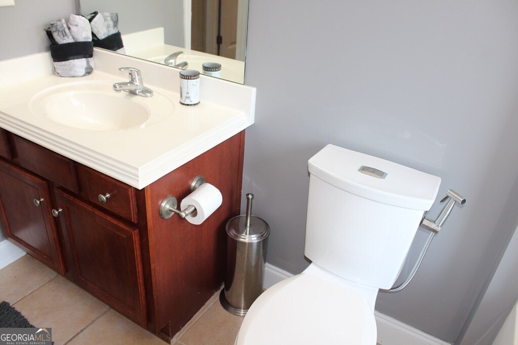 33 Lee Road Phenix City, AL 36870 - Photo 32 of 47 a bathroom with a sink mirror vanity and toilet