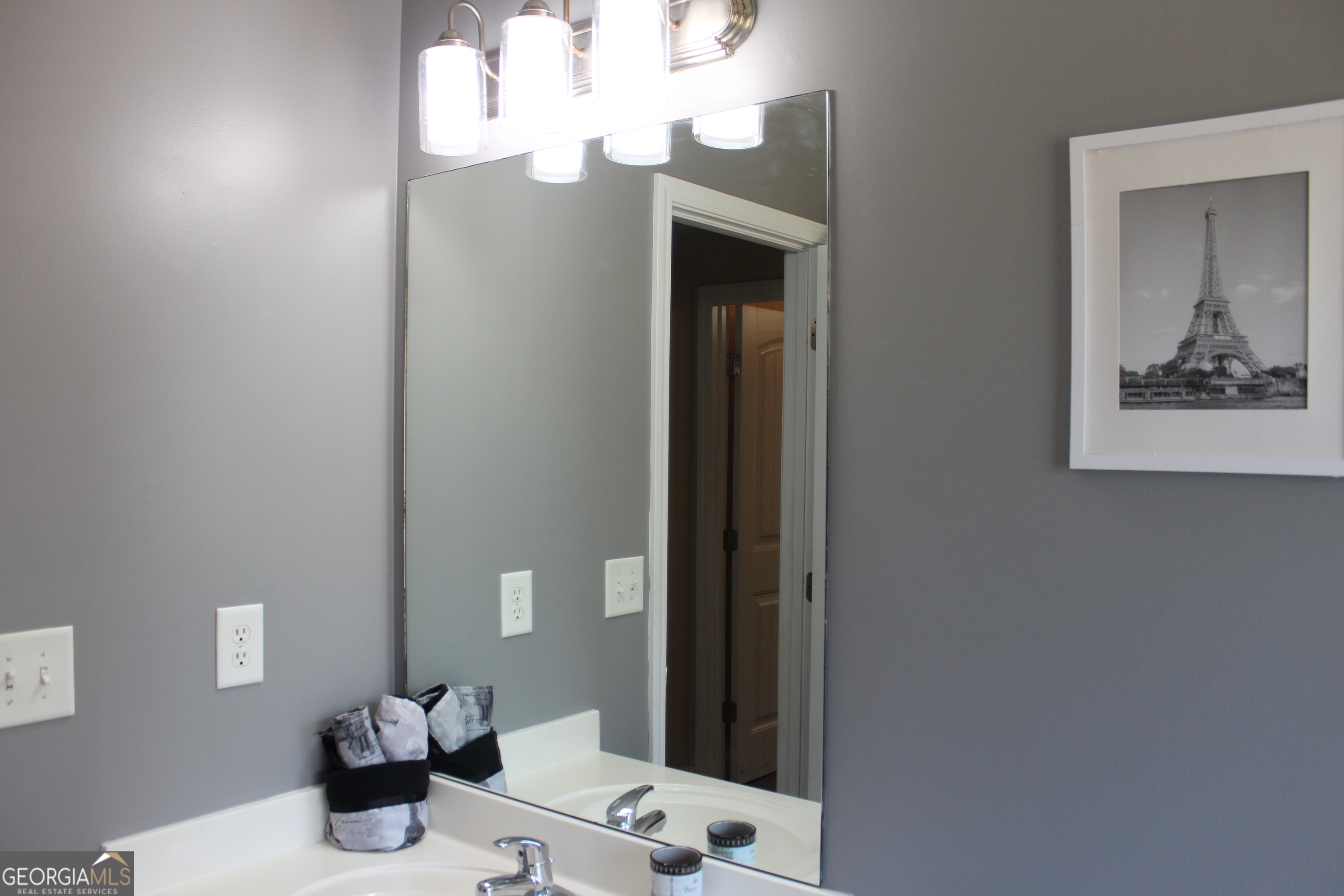 33 Lee Road Phenix City, AL 36870 - Photo 33 of 47 a bathroom with a sink mirror and vanity