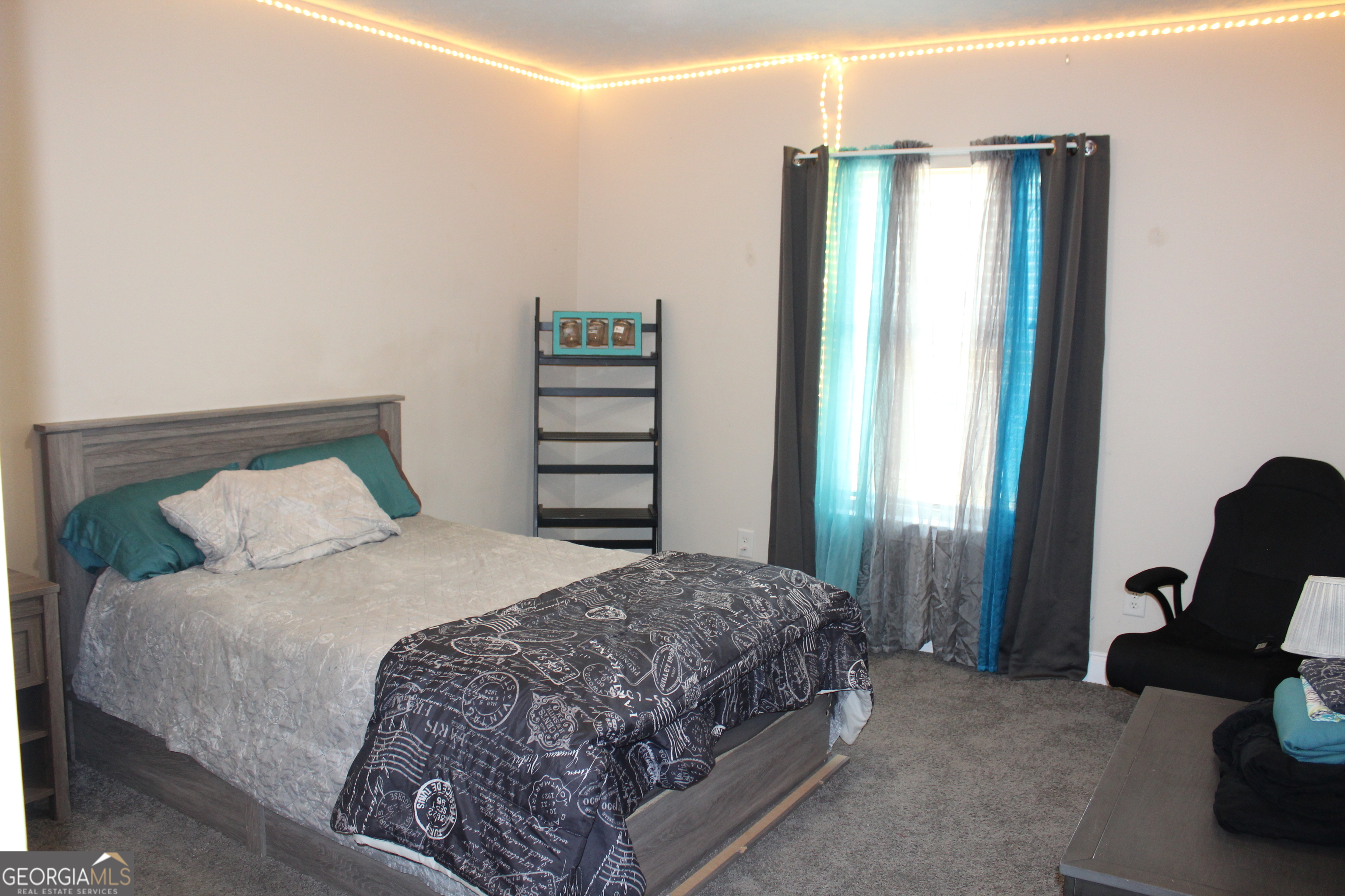 33 Lee Road Phenix City, AL 36870 - Photo 34 of 47 a bedroom with a bed and wooden floor