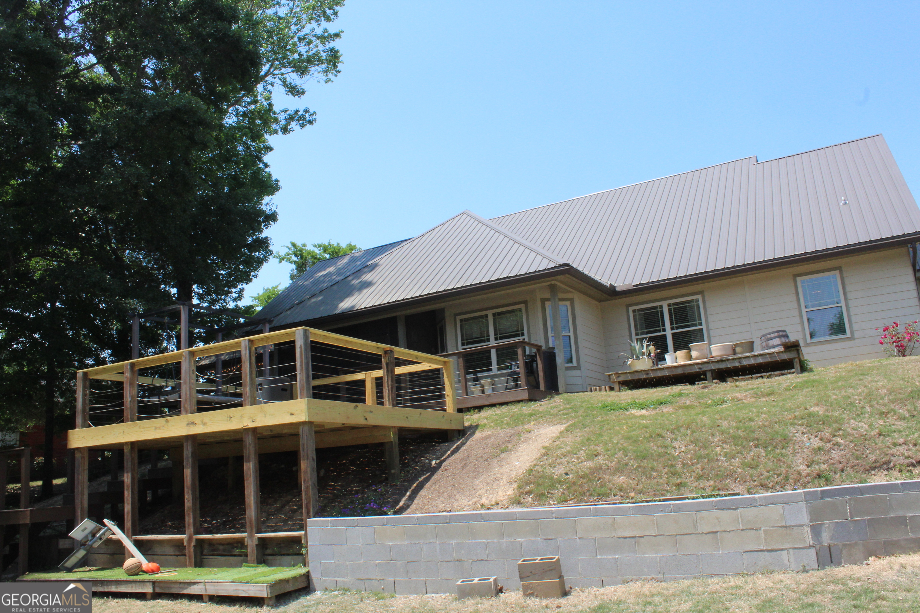 33 Lee Road Phenix City, AL 36870 - Photo 40 of 47 a view of a house with backyard porch and sitting area