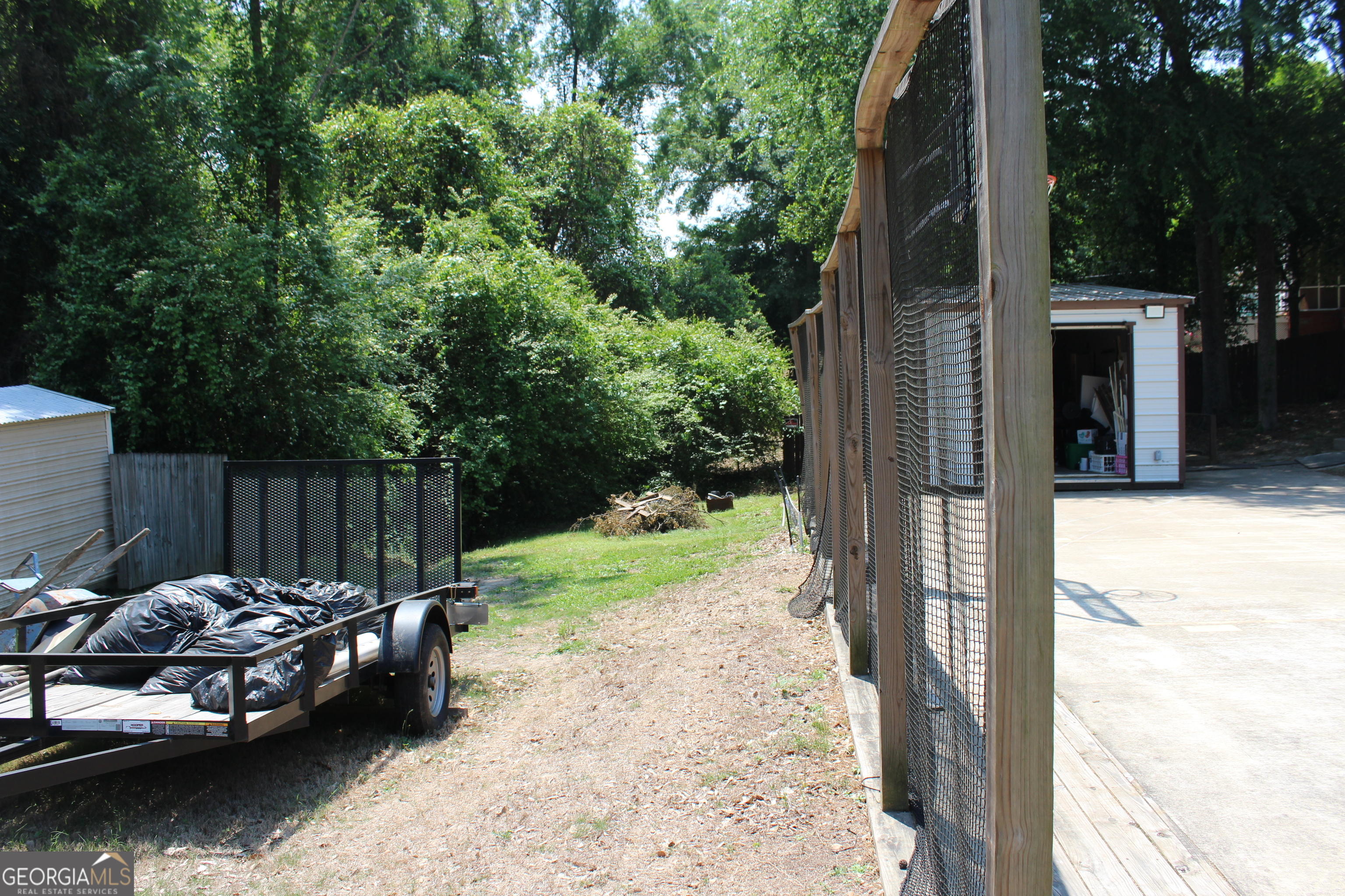 33 Lee Road Phenix City, AL 36870 - Photo 42 of 47 a view of backyard with small pool and wooden fence