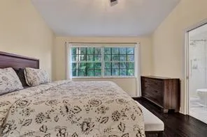 a bedroom with a bed and a fireplace