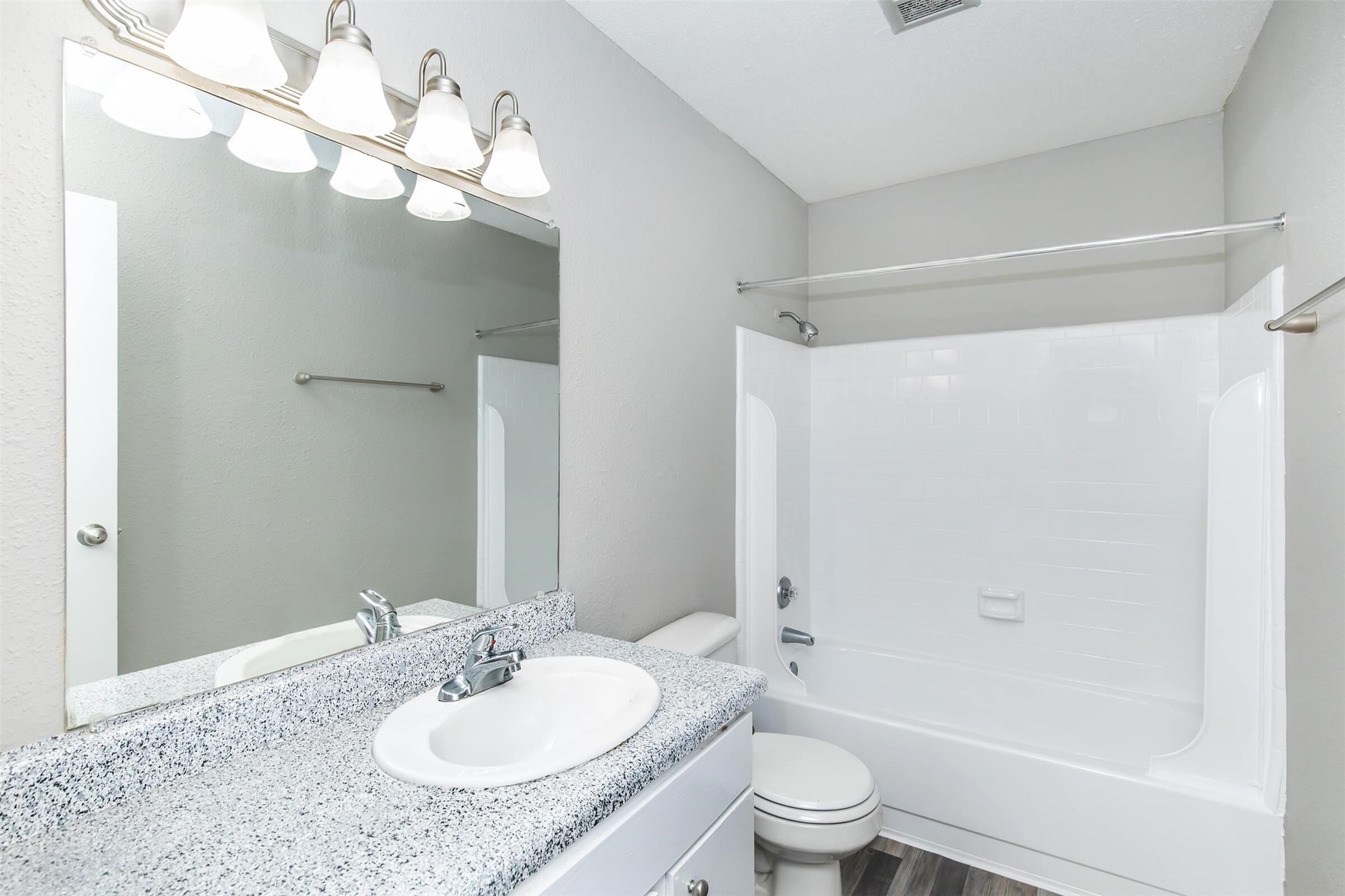 18001 Cypress Trace Road, Unit 506 Houston, TX 77090 - Photo 12 of 32 a bathroom with a granite countertop sink a toilet and shower