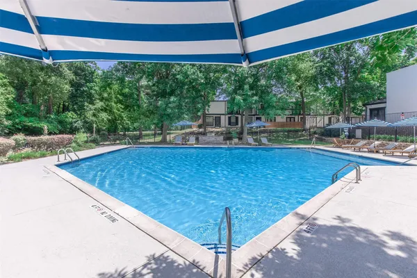 a view of a swimming pool with a balcony